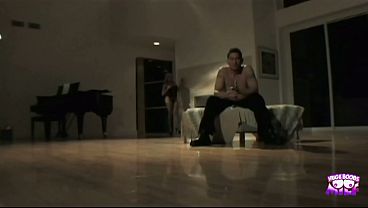 A blonde with a big bust drives her man crazy and gets a good screw.