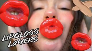 Red sticky messy lipgloss layers and pouting kisses