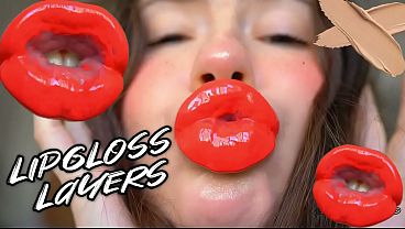 Red sticky messy lipgloss layers and pouting kisses